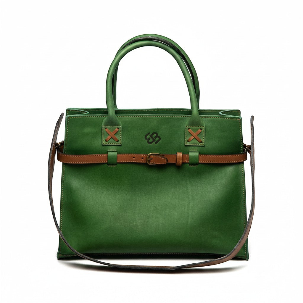 Blueberry Leather Duma forest green cowhide tote bag with brown buckle belt and top handles on white background.