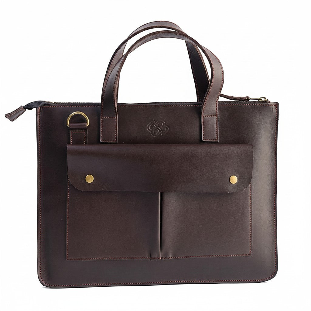 Blueberry Leather Mocca brown leather laptop sleeve with dual carry handles, front pockets, and gold hardware.