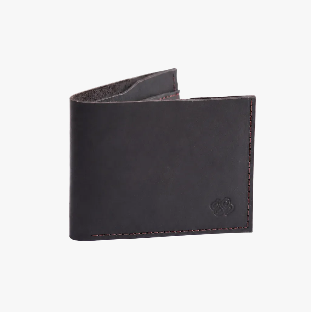 A black leather bifold wallet with visible stitching and a debossed logo on the lower right corner, photographed on a clean white background.