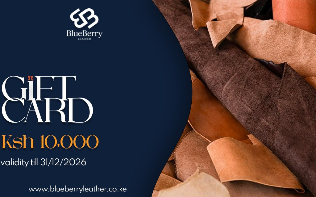 BlueBerry Leather gift card graphic with a dark navy left side featuring the BlueBerry logo and text reading 'GIFT CARD' and 'Ksh 10.000 validity till 31/12/2026', paired with a right side showing stacked brown leather pieces.