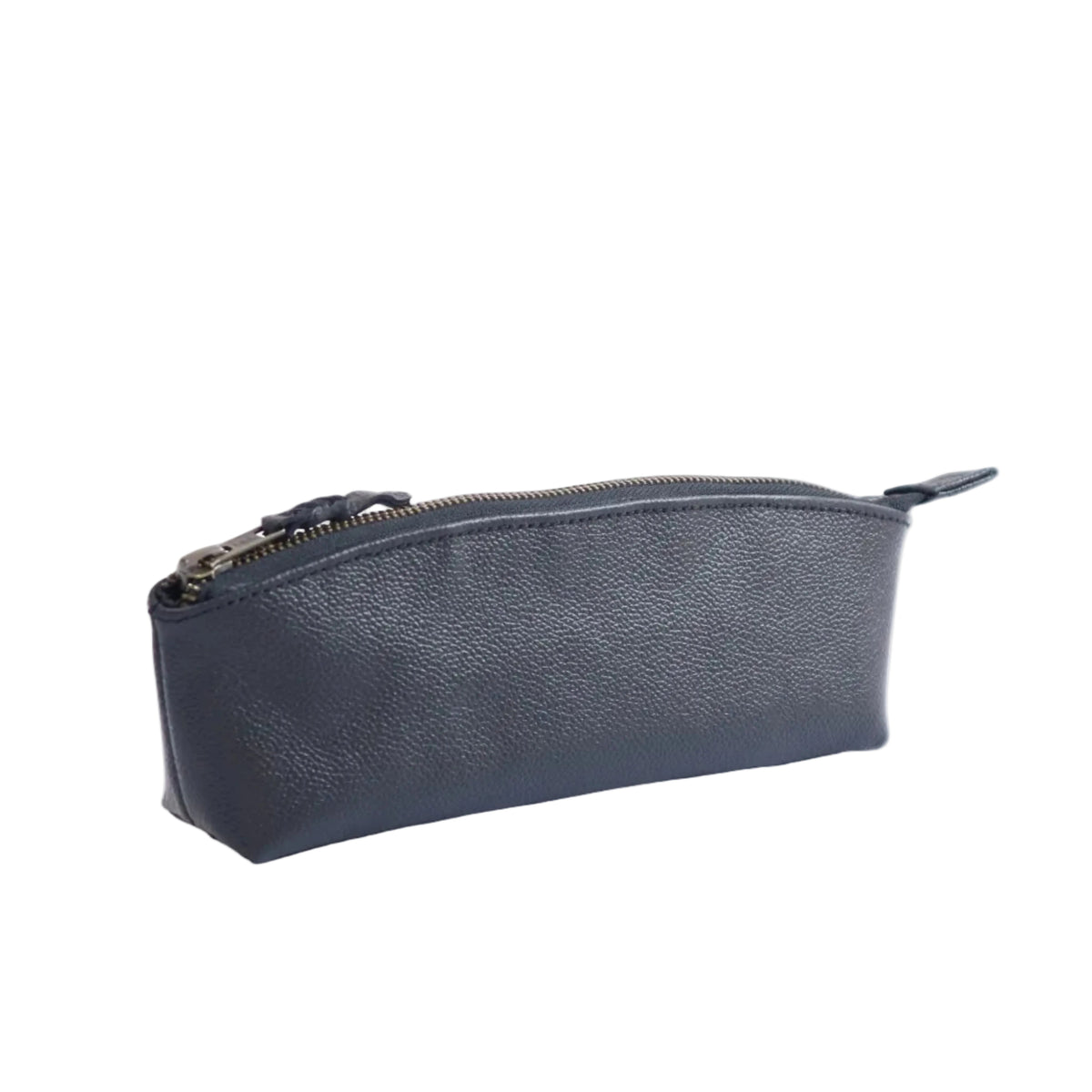 A black pebbled leather zippered pouch with a top zipper pull, photographed on a seamless white studio background.