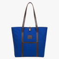 Blue tote bag with brown handles and a visible brand logo on a white background