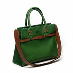 Blueberry Leather Duma Tote in forest green cowhide leather with a brown adjustable buckle strap and top handles.