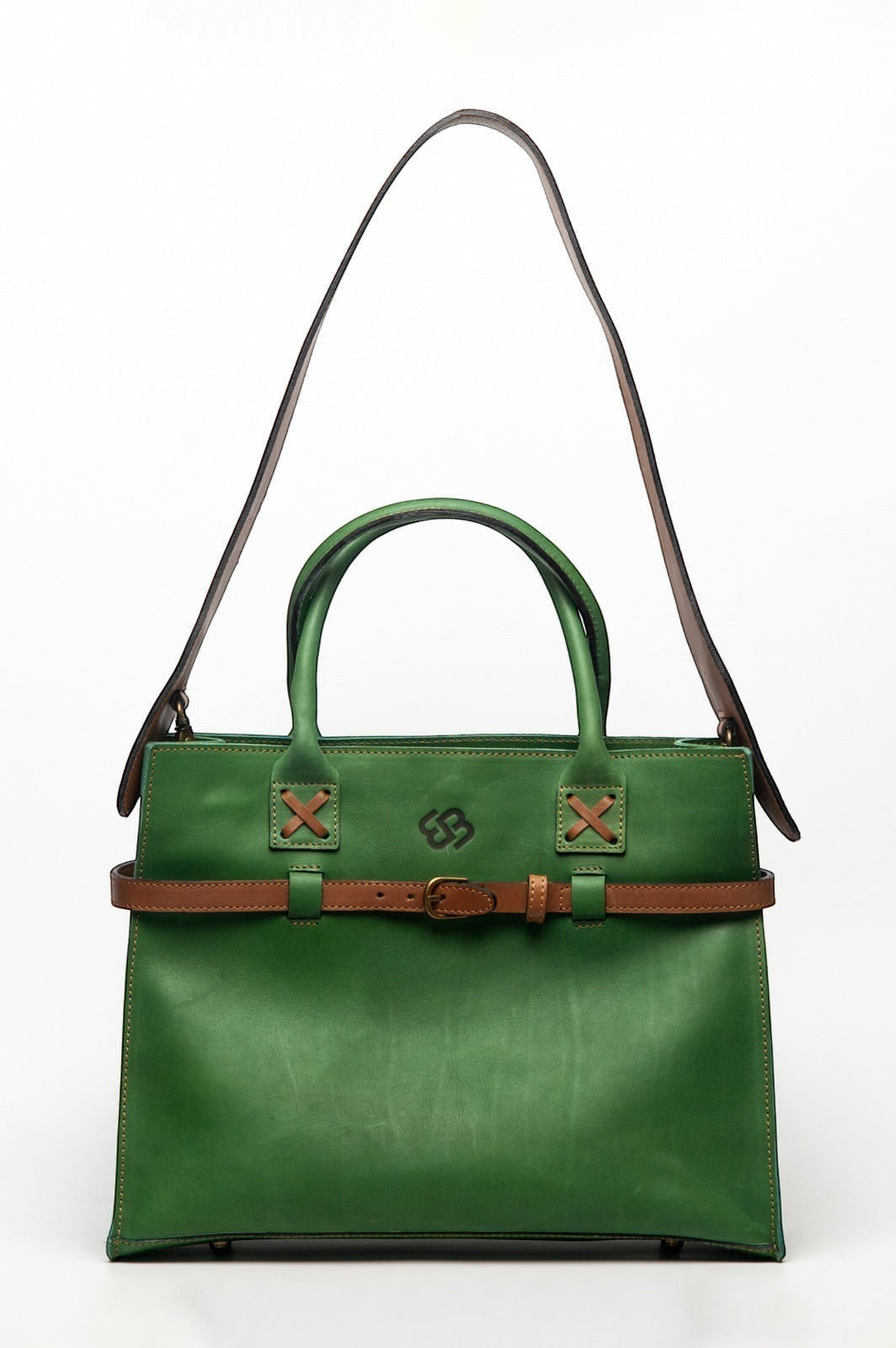 Blueberry Leather Duma Tote in forest green cowhide leather with a brown buckle belt and removable shoulder strap.
