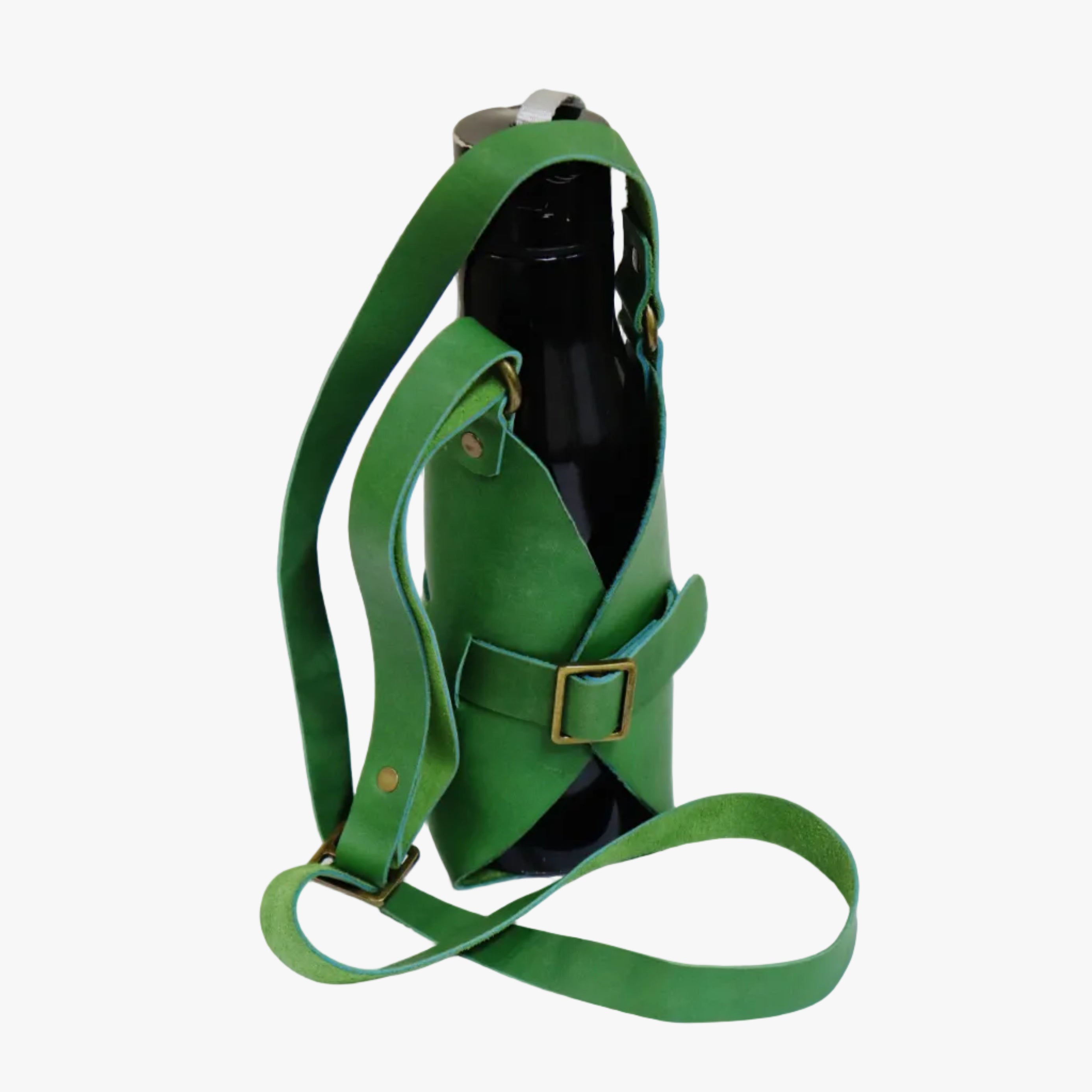 A green leather wine bottle carrier with adjustable straps and brass-tone hardware, shown holding a dark bottle on a plain white background.